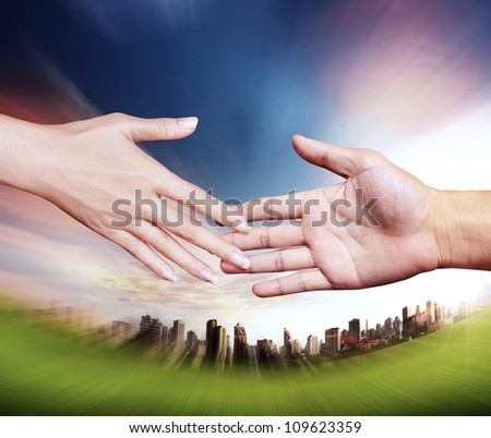 Two hands about to shake hands