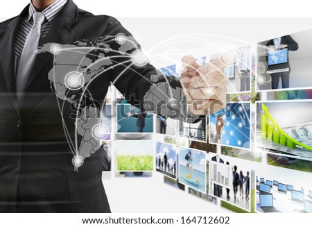 Business man reaching images streaming from the deep