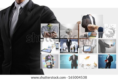 Business man reaching images streaming from the deep
