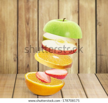 fresh juice pours from fruits on a white background