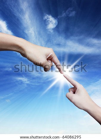 Hand pointing down and up on blue sky