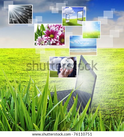 notebook against green nature background