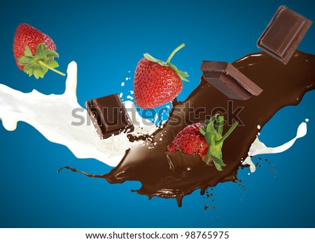 Chocolate and Strawberry falls into milk causing splash