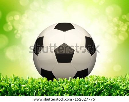 Soccer ball design on green grass background