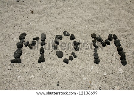 Background of mom spelled out using Hawaii volcanic rocks