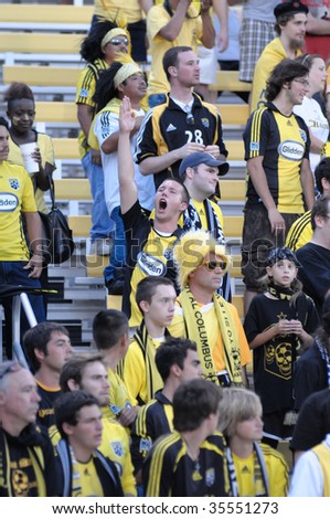 COLUMBUS, OH - AUGUST 18 : A lone Columbus Crew fans leads the crowd chants at Crew Stadium August 19, 2009 in Columbus, Ohio.