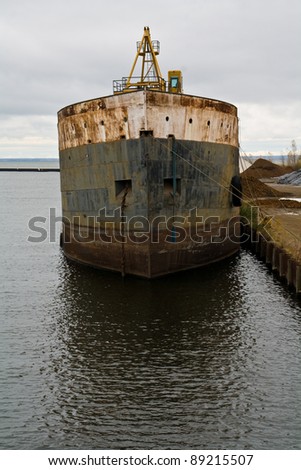 an old cargo ship at the dock