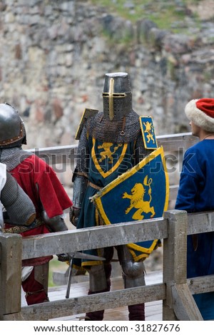 CESIS, LATVIA, June 7: Knight sword fight on wooden bridge during  the medieval festival Livonia. 1378. Held in Cesis, Latvia on June 7, 2009