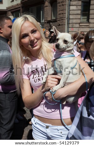 RIGA, LATVIA - MAY 29: A girl poses with her dog during the \