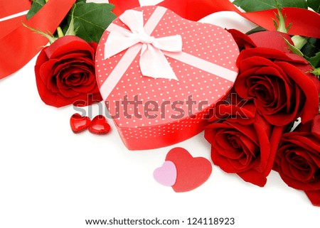Heart shaped Valentines Day gift box with red roses over white