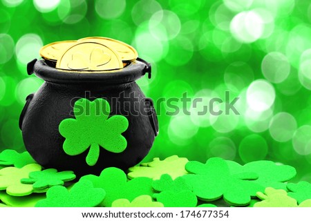 St Patricks Day Pot of Gold and shamrocks over a green background