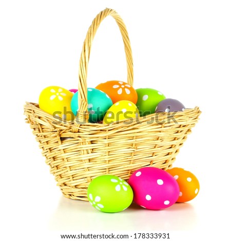 Easter basket filled with colorful eggs over a white background Easter basket filled with colorful eggs over a white background