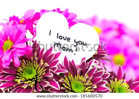 I love you Mom card amongst a vibrant bouquet of flowers