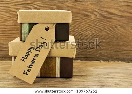 Fathers Day gifts with tag over a wooden background