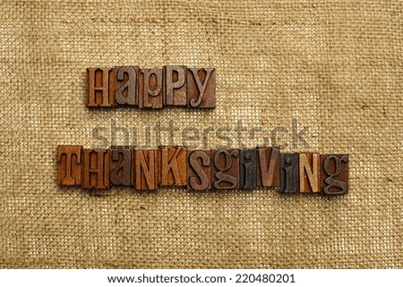 Happy Thanksgiving written with wooden letters on burlap