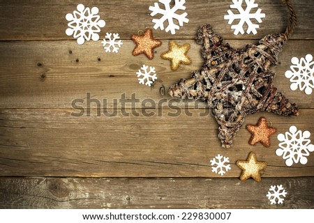 Wooden Christmas background with star and snowflake corner border