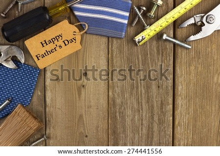 Happy Fathers Day gift tag with corner border of tools and ties on a rustic wood background