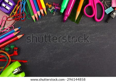 School supplies top corner border on a chalkboard background