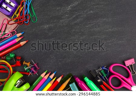 School supplies bottom corner border on a chalkboard background