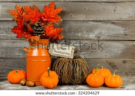 Happy Thanksgiving tag, pumpkins and autumn home decor with rustic wood background