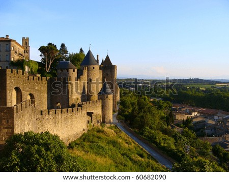 The medieval fortress of Caracassonne overlooking the countryside of southern France at sunset