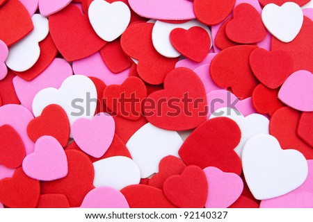 Colorful textured Valentines Day heart-shaped confetti background