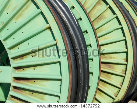 metal spools of wire in the yard of a electric power company utility