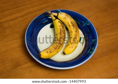 old bananas in a bowl