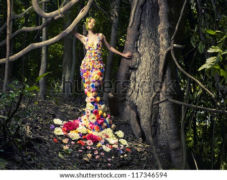 Blooming Gorgeous Lady In A Dress Of Flowers In The Rainforest