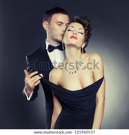 Fashion photo of sexy elegant couple in the tender passion