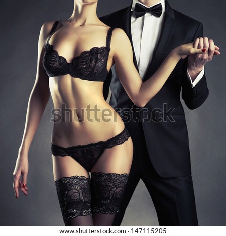 Art Photo Of A Young Couple In Sensual Lingerie And A Tuxedo