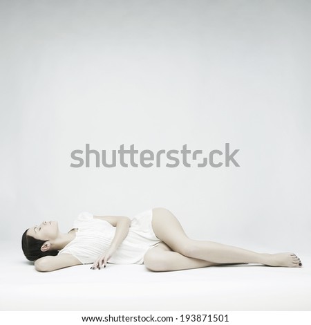 Elegant beautiful sleeping lady on white background