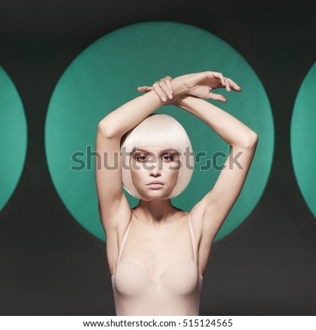 Beautiful makeup. Sexy woman with art makeup. Nude sexy blonde with smoke on the background. Woman with professional makeup. Female fashionable makeup. Beautiful nude blonde with sexy evening makeup.