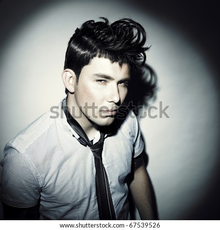 Portrait of a handsome stylish man with a cool hairstyle