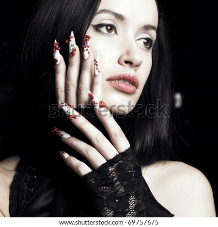 Lifestyle Stock-photo-portrait-of-a-beautiful-young-woman-with-long-designer-nails-69757675