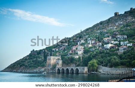 beautiful mountain village with houses on the water blue in the distant landscape with sea