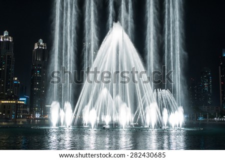 DUBAI, UAE - APRIL 03, 2013: The Dubai Dancing Fountain - wonderful evening show