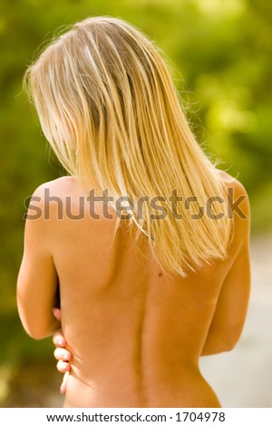 stock photo a nude blonde in the forest