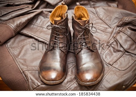 fashionable leather boots and leather jacket. handmade shoes