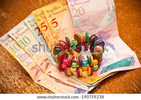 The national currency of Venezuela, Latin America. Colorful handmade bracelet