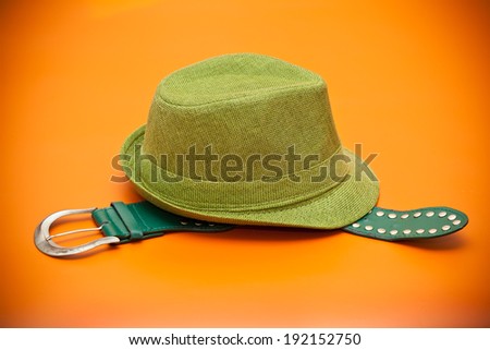 Green hat and green belt with a buckle in western style
