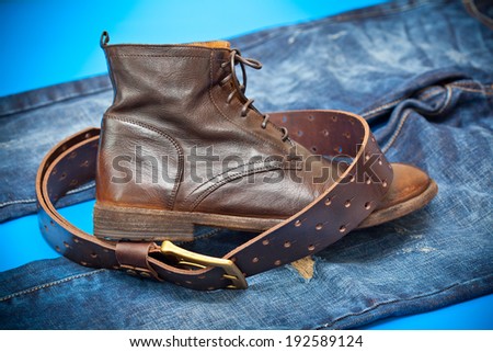 Fashionable leather shoes, leather belt and jeans. cowboy style
