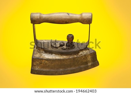 old iron on a yellow background