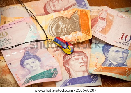 National currency of Venezuela - Bolivar. Suspension - souvenir, painted in the colors of the flag of Venezuela