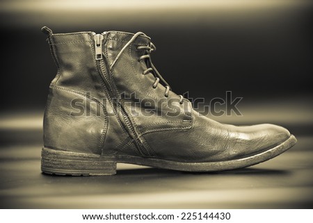 Fashionable men\'s shoes. photo tinted yellow. Black-and-white photography. Vintage style