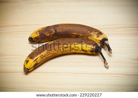 Old banana on wooden board