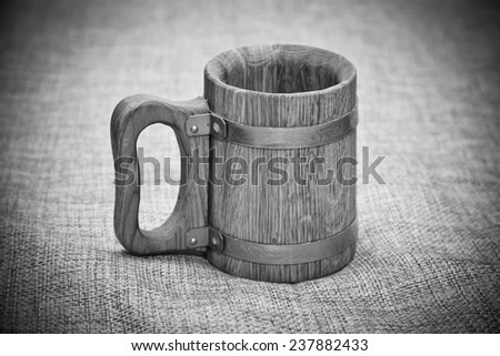 Old wooden mug. Black and white photo