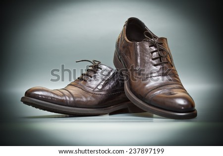 classic expensive leather shoes on abstract background