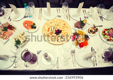 Festive table - salads, snacks and drinks. top view