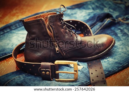 Fashion trend - jeans, leather shoes, leather belt with buckle